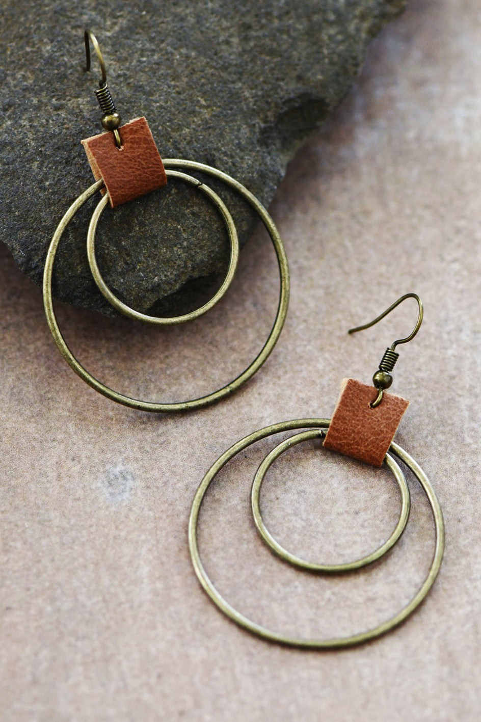 DOUBLE CIRCLE DROP EARRINGS WITH LEATHER ACCENT