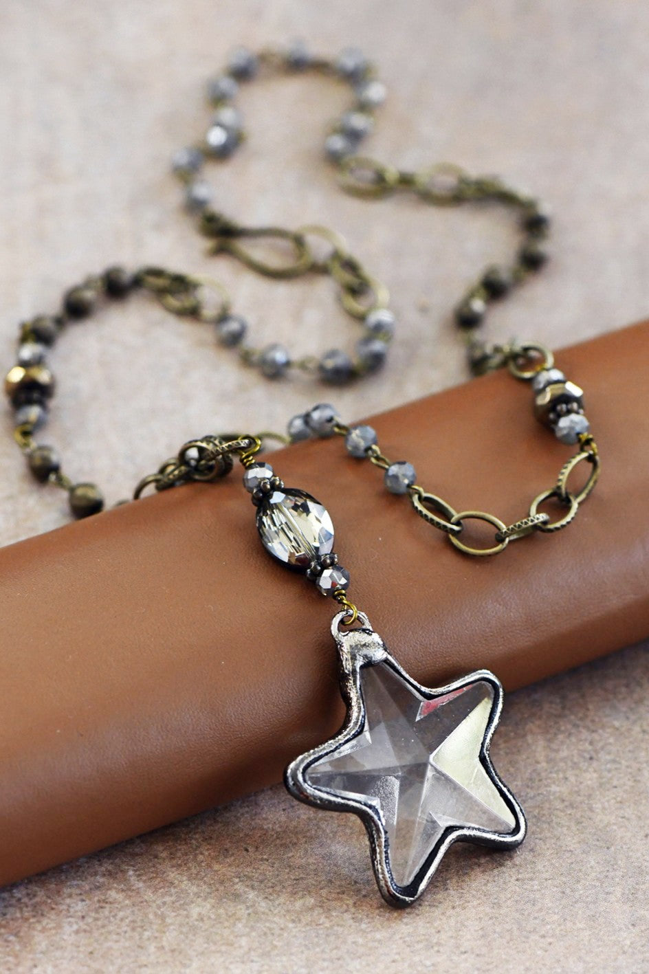 LONG BEAD CHAIN NECKLACE WITH CRYSTAL STAR PENDANT